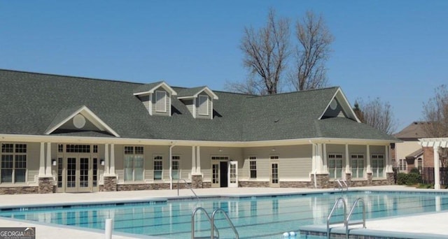 pool featuring a patio area and french doors