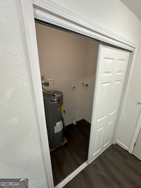 utility room featuring electric water heater