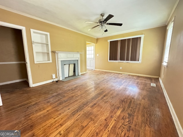 unfurnished living room with a brick fireplace, built in features, ceiling fan, and wood-type flooring