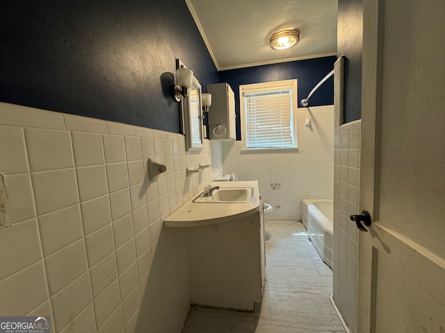 bathroom featuring tile walls, vanity, and tiled shower / bath