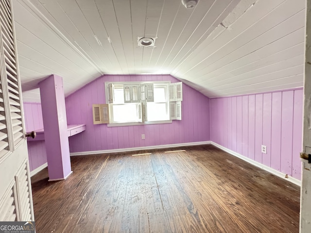 bonus room featuring dark hardwood / wood-style flooring and vaulted ceiling