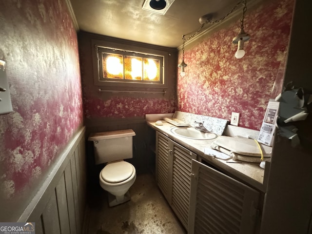 bathroom featuring toilet and vanity