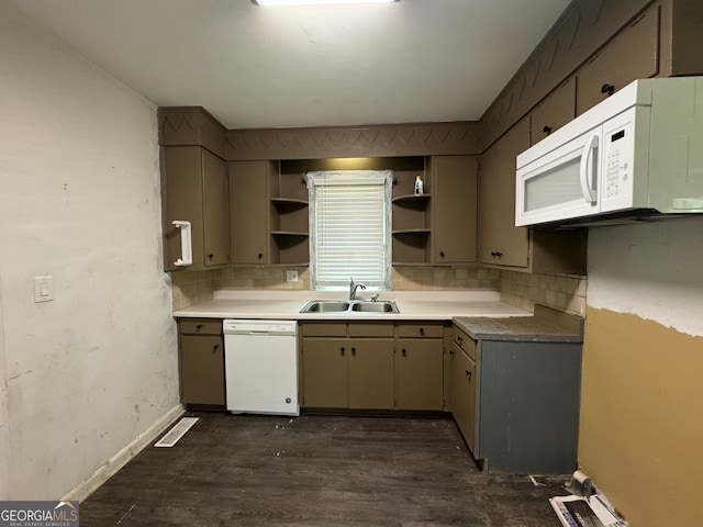 kitchen featuring sink, dark hardwood / wood-style flooring, white appliances, and decorative backsplash