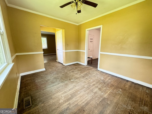 spare room with ceiling fan, crown molding, and hardwood / wood-style flooring