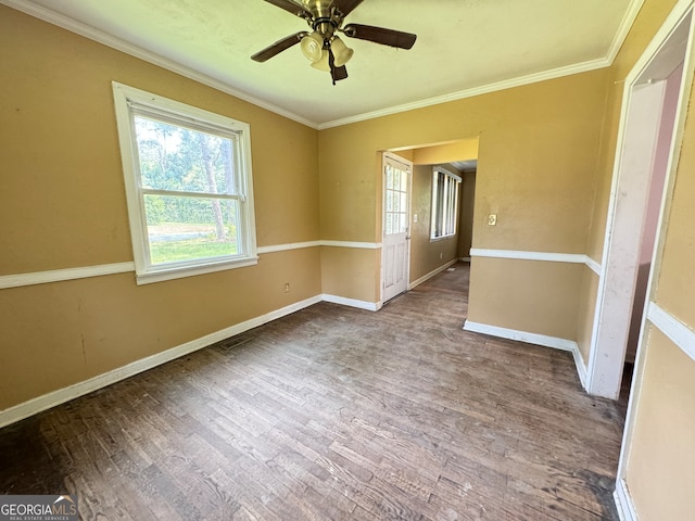 spare room featuring hardwood / wood-style floors, ornamental molding, and ceiling fan