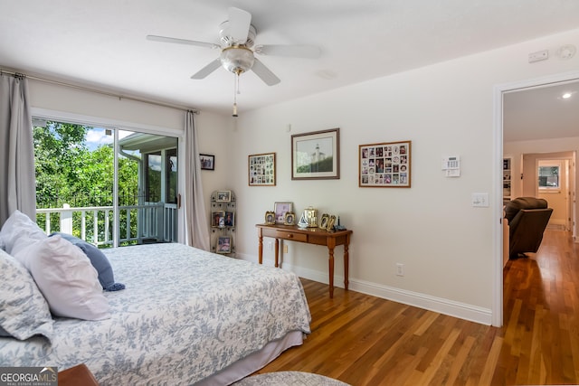 bedroom featuring hardwood / wood-style floors, ceiling fan, and access to outside