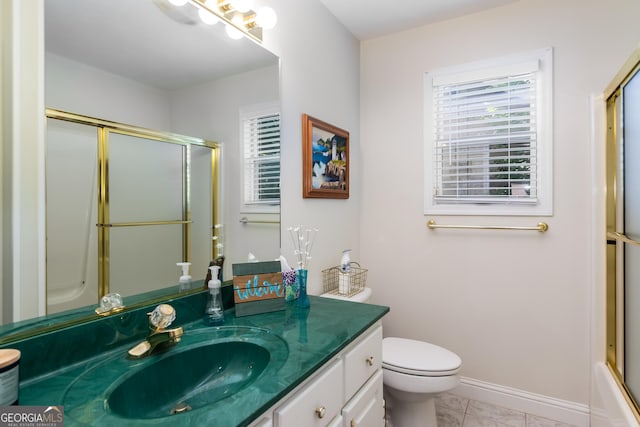 full bathroom with tile patterned flooring, vanity, toilet, and a wealth of natural light