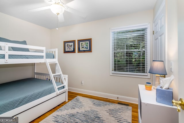 bedroom featuring ceiling fan and wood-type flooring