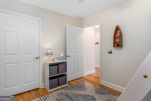 bedroom featuring ceiling fan and hardwood / wood-style flooring