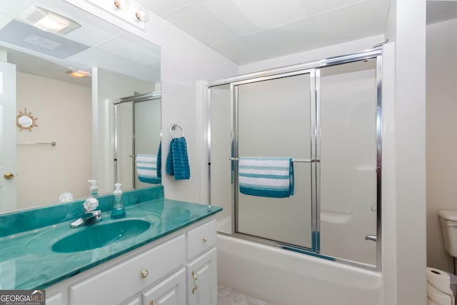 full bathroom featuring vanity, toilet, and bath / shower combo with glass door