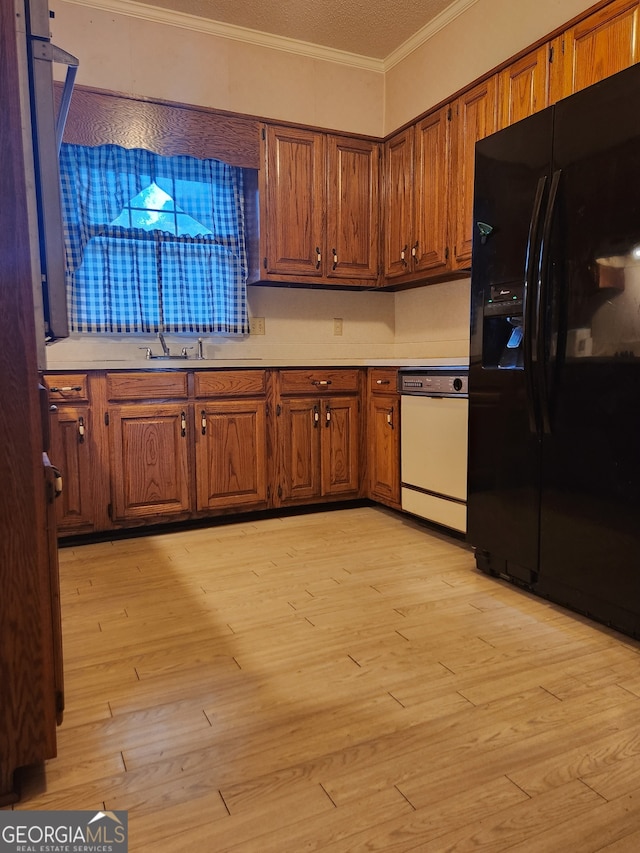 kitchen with crown molding, light hardwood / wood-style flooring, white dishwasher, and black fridge