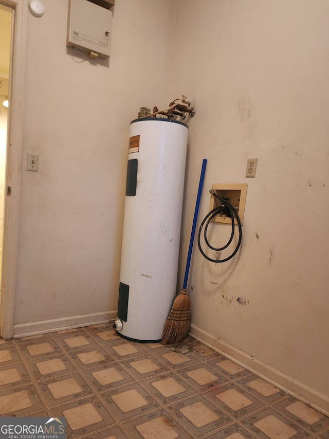 utility room featuring water heater