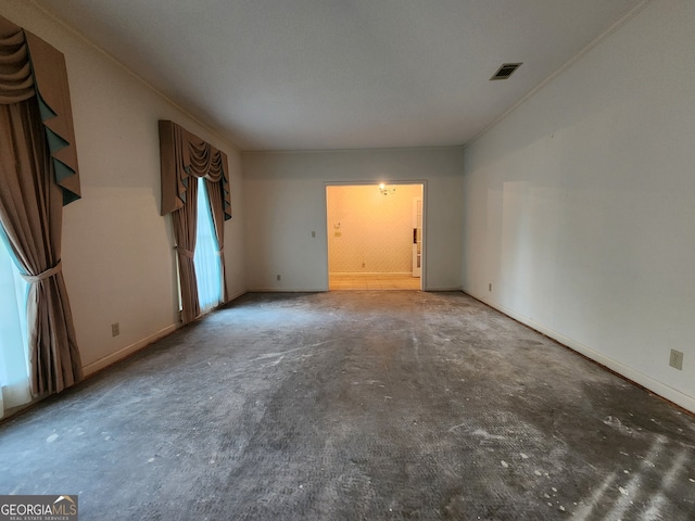 unfurnished room featuring crown molding