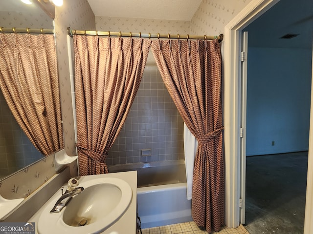 bathroom with sink, tile patterned flooring, and shower / bath combination with curtain