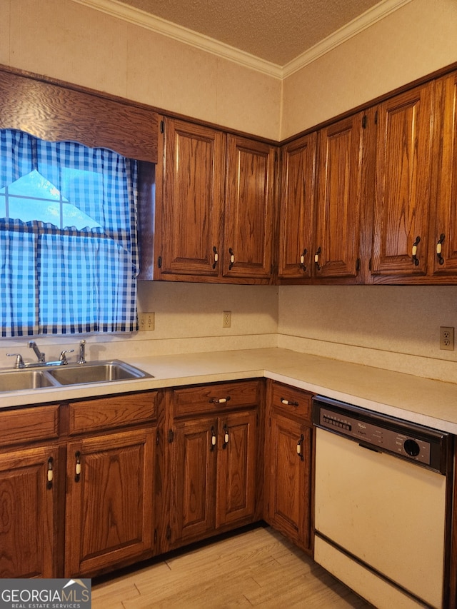 kitchen featuring ornamental molding, sink, dishwasher, and light hardwood / wood-style floors