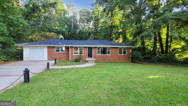 ranch-style home with a front lawn and a garage