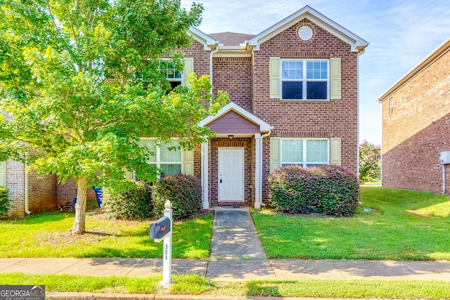 view of front of home featuring a front lawn