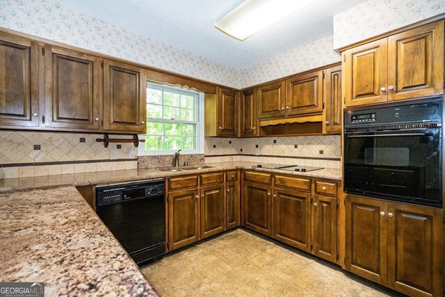 kitchen with black appliances, light tile patterned flooring, sink, and backsplash