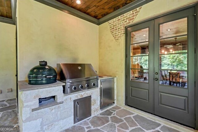 view of patio / terrace with french doors, exterior kitchen, and a grill