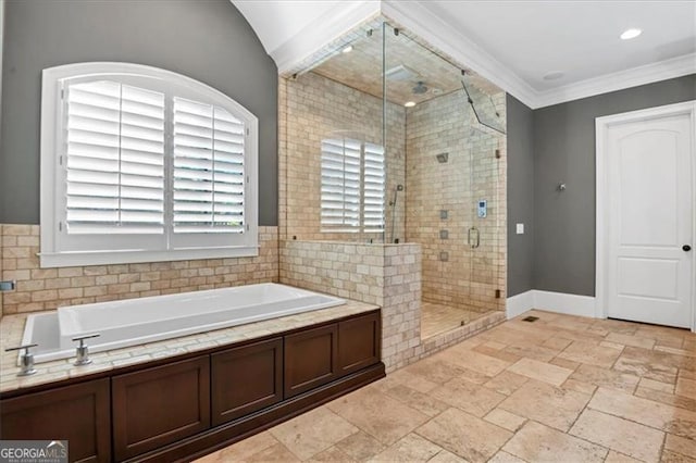 bathroom with plus walk in shower, ornamental molding, and tile patterned floors