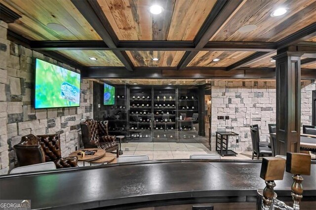 bar featuring tile countertops, tile patterned flooring, sink, and wood ceiling