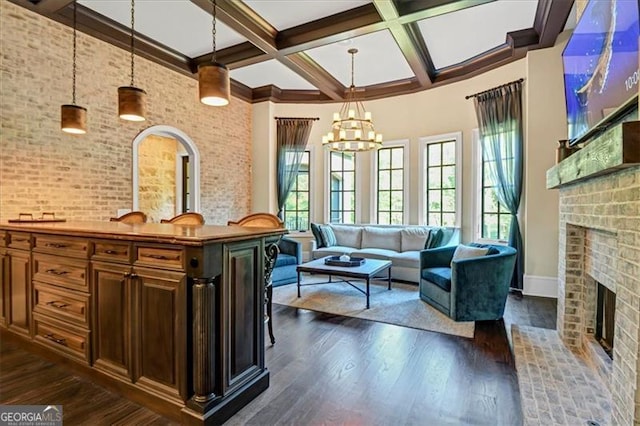 interior space with a wealth of natural light, dark hardwood / wood-style floors, and a fireplace