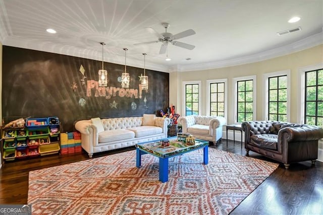 living room featuring hardwood / wood-style flooring, ceiling fan, plenty of natural light, and ornamental molding