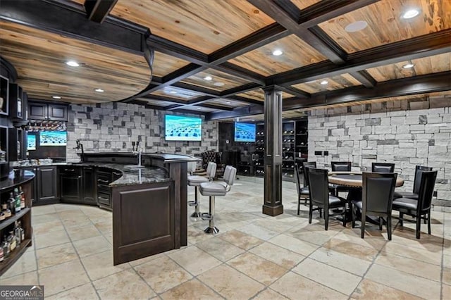 kitchen with dark stone counters, wooden ceiling, coffered ceiling, and light tile patterned flooring