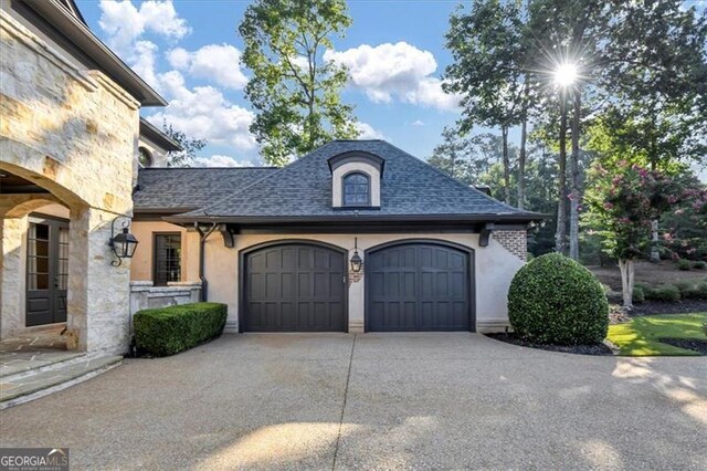 view of side of home with a garage