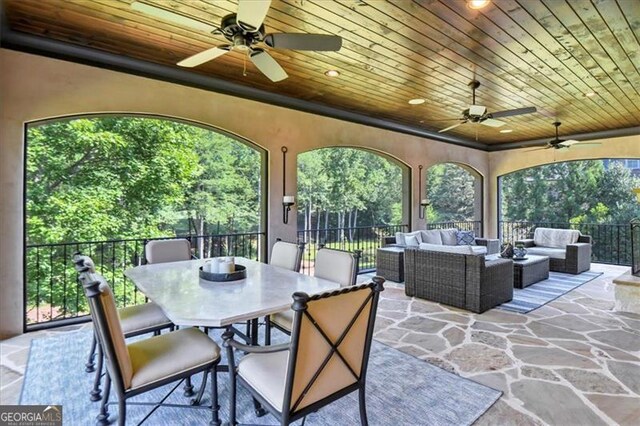 view of patio with ceiling fan and an outdoor living space