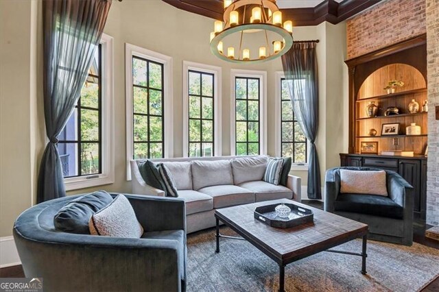 interior space with a chandelier, wood-type flooring, and a healthy amount of sunlight