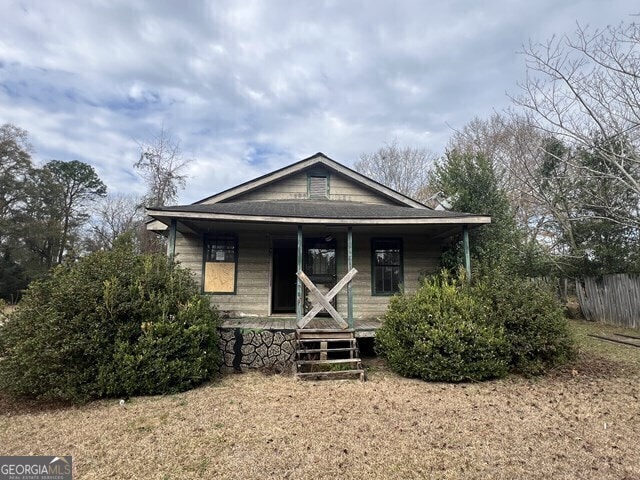 bungalow-style home featuring a porch