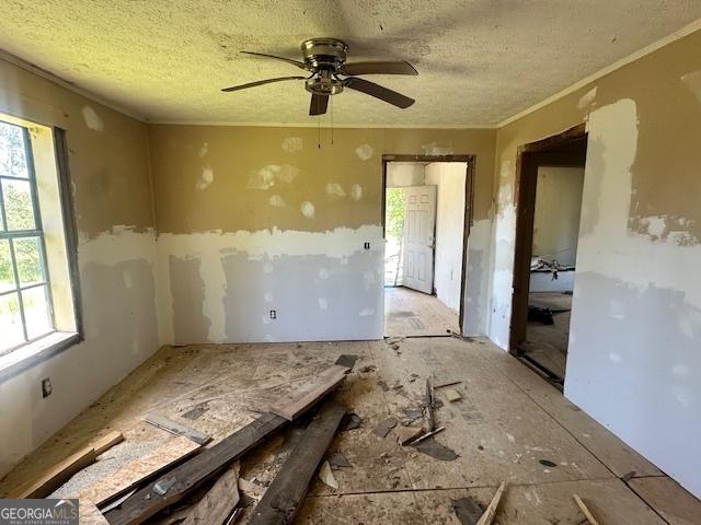 902 Georgia St, Vidalia, GA 30474 - spare room featuring healthy amount of natural light, a ceiling fan, and a textured ceiling