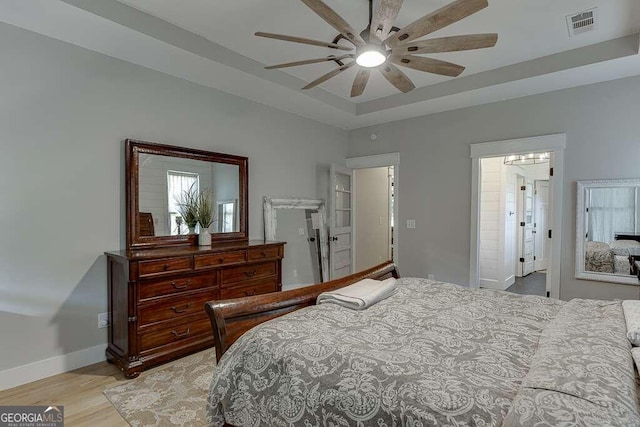 bedroom featuring light hardwood / wood-style floors and ceiling fan