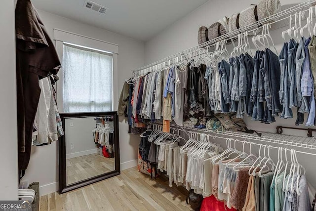 spacious closet featuring hardwood / wood-style floors