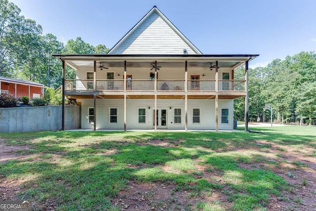 back of house with a yard, ceiling fan, and a patio area