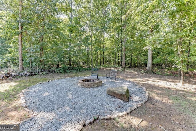 view of yard featuring a fire pit