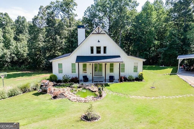 modern farmhouse with a front yard and a porch