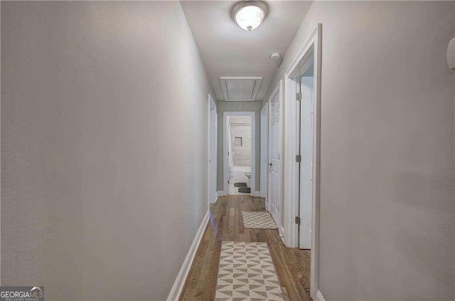 hallway featuring hardwood / wood-style flooring