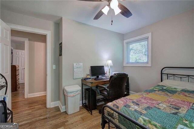 bedroom featuring ceiling fan and hardwood / wood-style flooring