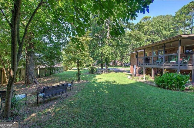 view of yard featuring a wooden deck