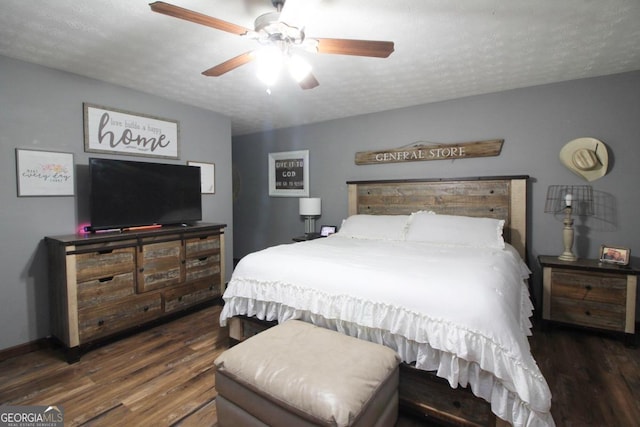 bedroom featuring a textured ceiling, dark hardwood / wood-style flooring, and ceiling fan