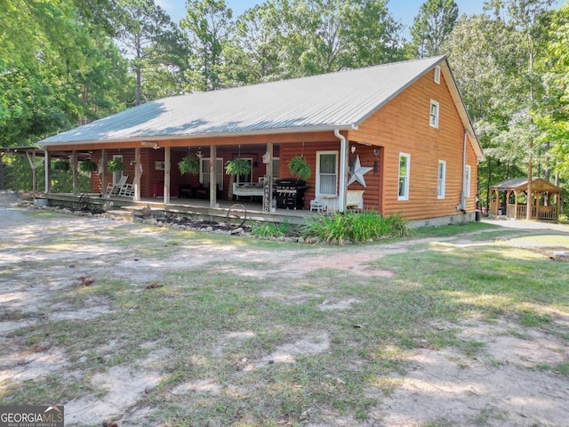 log home featuring a gazebo