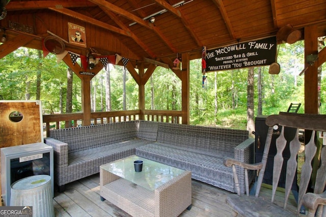 deck featuring a gazebo and outdoor lounge area