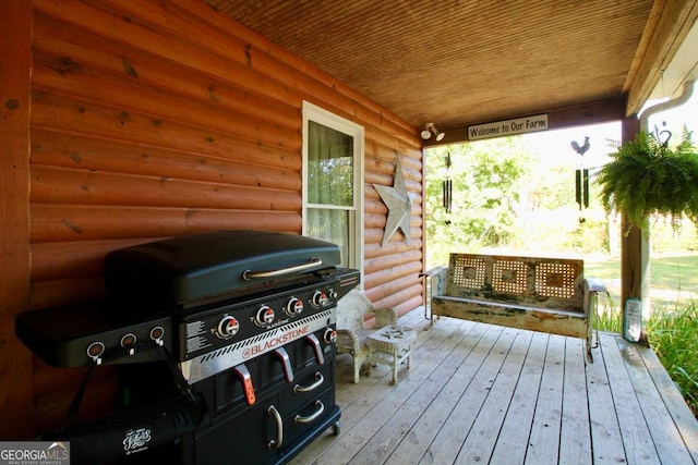 deck featuring a grill