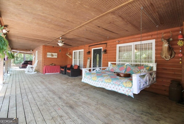 wooden deck with ceiling fan