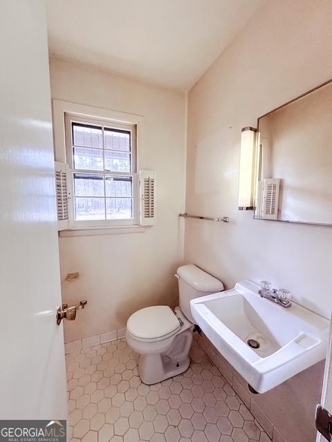 bathroom with toilet and sink