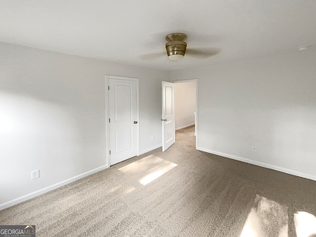 interior space featuring carpet flooring and ceiling fan