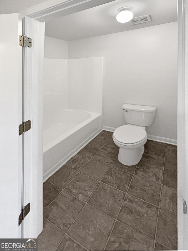 bathroom featuring toilet, independent shower and bath, and tile patterned floors