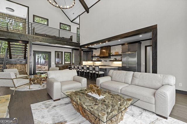 living room with beamed ceiling, light wood-type flooring, and high vaulted ceiling